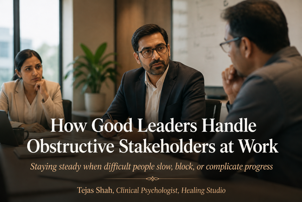 Indian workplace leader dealing with difficult stakeholders calmly during a tense professional meeting