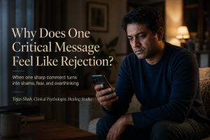 Indian adult reading a critical message and feeling rejected, representing why criticism feels like rejection | Healing Studio | Tejas Shah